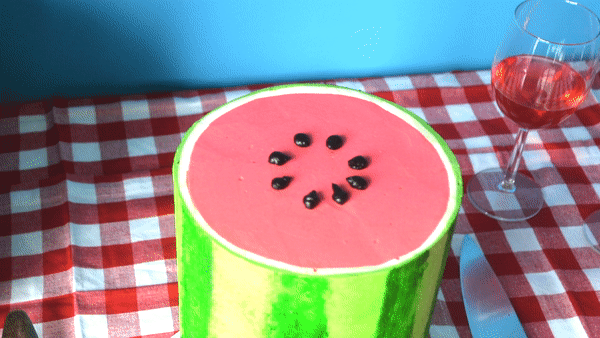 Pipe on your black seeds to complete the cake